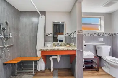 a bathroom with a sink and a toilet at Quality Inn & Suites Airport-Cruise Port Hollywood in Hollywood