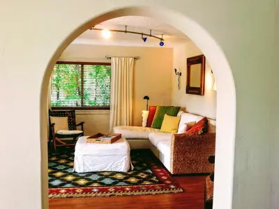 an archway in a living room with a couch at Villa Venezia in Fort Lauderdale