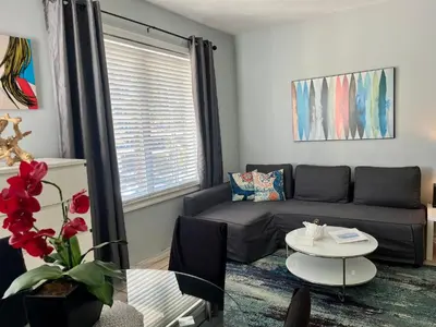a living room with a couch and a table at Ocean Dream in Miami Beach