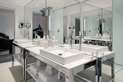 a bathroom with two sinks and a large mirror at Dua Miami, Autograph Collection in Miami
