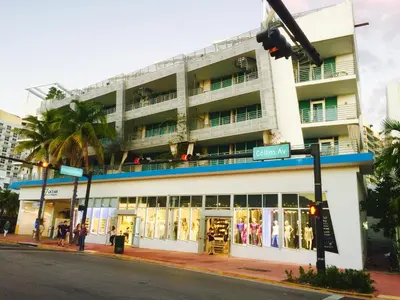 a building on the corner of a street at Apartment at De Soleil Hotel on Ocean Drive in Miami Beach