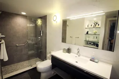 a bathroom with a sink and a shower and a toilet at Yacht Club at Aventura Luxurious 1 Bed 1 Bath in Aventura