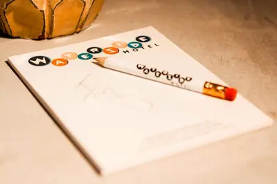 a pen sitting on top of a piece of paper at Waterside Hotel and Suites in Miami Beach