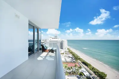 a balcony with a view of the ocean at Global Luxury Suites at Monte Carlo in Miami Beach