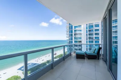 a balcony with a view of the ocean at Global Luxury Suites at Monte Carlo in Miami Beach