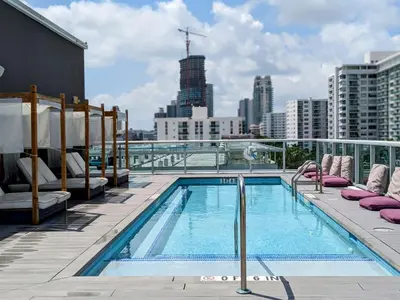 a swimming pool on the roof of a building at ABAE Hotel by Eskape Collection in Miami Beach