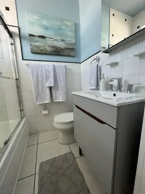 a bathroom with a sink and a toilet and a shower at Suite Love in Miami Beach