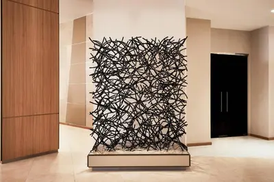 a sculpture in a room with a wall at AC Hotel by Marriott Miami Aventura in Aventura