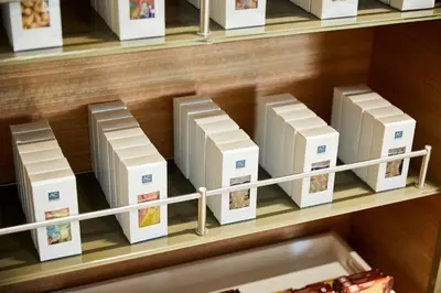 a bunch of boxes on a shelf in a store at AC Hotel by Marriott Miami Aventura in Aventura