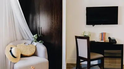 a living room with a chair and a desk at Casa Boutique Hotel in Miami Beach