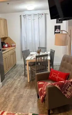 a kitchen and dining room with a table and chairs at Hotel Ponce de Leon in Miami