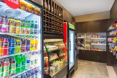 a refrigerator filled with lots of different types of drinks at Wingate by Wyndham Miami Airport in Miami