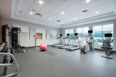 a gym with a lot of treadmills and machines at Home2 Suites By Hilton Ft. Lauderdale Airport-Cruise Port in Dania Beach