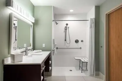 a bathroom with a sink and a shower at Home2 Suites By Hilton Ft. Lauderdale Airport-Cruise Port in Dania Beach