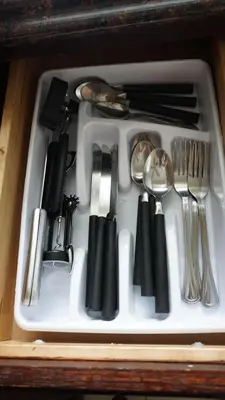 a white tray with utensils in a drawer at Golden Sand Oceanfront in Hollywood
