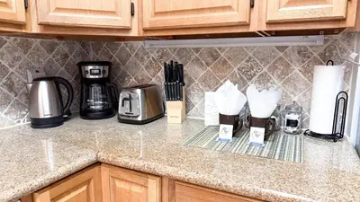 a kitchen counter with a coffeemaker and coffee makers at The Tides 1bedroom apt 3rd floor We are on the Beach! in Hollywood
