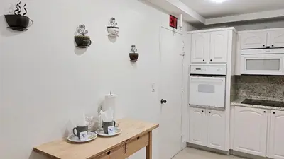 a kitchen with white walls and a wooden counter top at THE TIDES 2bedrooms apt 14th floor WE ARE ON THE BEACH! in Hollywood