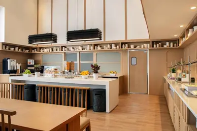 a large kitchen with a counter and a table at Residence Inn by Marriott Miami Aventura Mall in Aventura