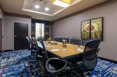 a conference room with a table and chairs at Cambria Hotel Ft Lauderdale, Airport South & Cruise Port in Dania Beach