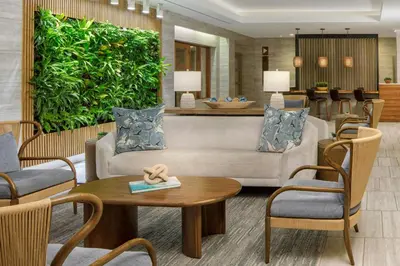 a lobby with a couch and tables and chairs at The Westin Fort Lauderdale Beach Resort in Fort Lauderdale