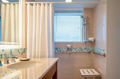 a bathroom with a sink and a shower at The Westin Fort Lauderdale Beach Resort in Fort Lauderdale