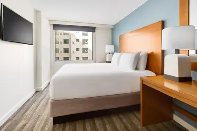 a hotel room with a bed and a television at Hyatt House Fort Lauderdale Airport/Cruise Port in Dania Beach