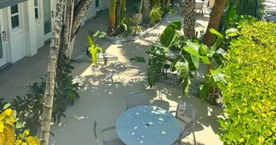 an overhead view of a table and chairs on a patio at Park Royal Miami Beach in Miami Beach