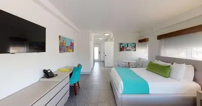 a bedroom with a large bed and a television at Park Royal Miami Beach in Miami Beach