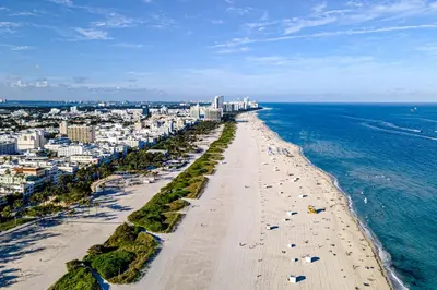 an aerial view of a beach and the ocean at Modern Ocean Drive Condo in the Heart of Sobe! in Miami Beach