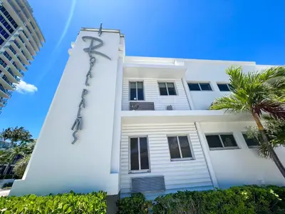 a white building with a scientology sign on it at Royal Palms Resort & Spa in Fort Lauderdale