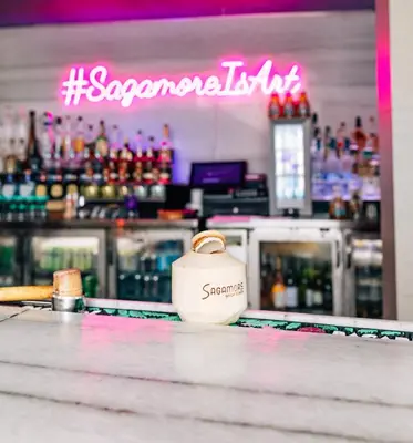a bottle of schnapps sitting on the counter of a bar at The Sagamore Hotel South Beach in Miami Beach