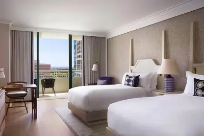 a hotel room with two beds and a balcony at The Ritz-Carlton Coconut Grove, Miami in Miami