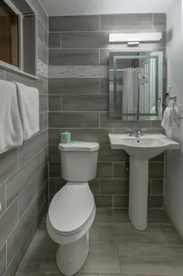 a bathroom with a toilet and a sink at Beach and Town Motel in Hollywood