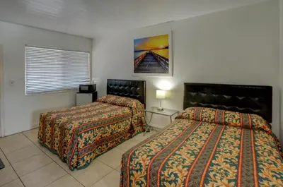 a hotel room with two beds and a picture on the wall at Beach and Town Motel in Hollywood