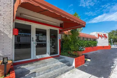 a eatery with stairs outside of a building at Beach and Town Motel in Hollywood