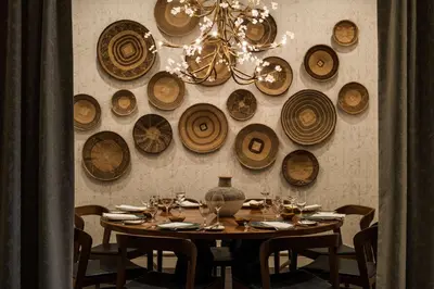 a dining room with a table and a bunch of hats on the wall at Hyatt Regency Coral Gables in Miami in Miami
