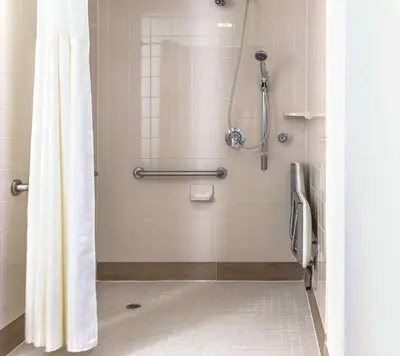 a bathroom with a shower with a shower curtain at Homewood Suites by Hilton Miami - Airport West in Miami