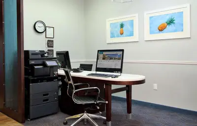 an office with a desk with a computer on it at Homewood Suites by Hilton Miami - Airport West in Miami