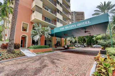 a building with a sign that reads theinity hotel at The Mutiny Luxury Suites Hotel in Miami