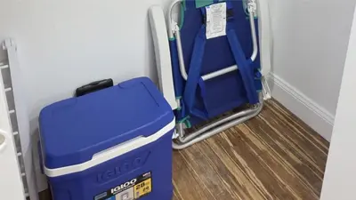 a blue cooler sitting next to a door at The Tides-1 bedroom apartment Ground Floor in Hollywood