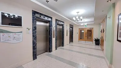 a hallway of a building with doors and a hallwayngth at The Tides-1 bedroom apartment Ground Floor in Hollywood