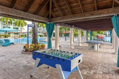 a blue and white foosball table on a patio at Marriott's Villas At Doral in Miami