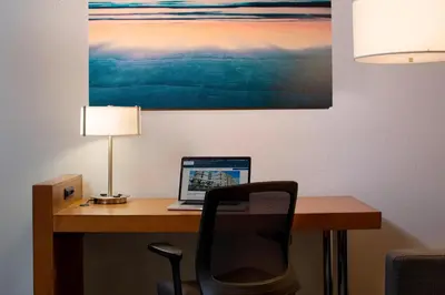 a desk with a laptop computer on top of it at SpringHill Suites Miami Downtown/Medical Center in Miami
