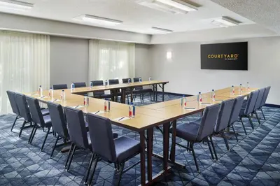 a conference room with a long table and chairs at Courtyard by Marriott Fort Lauderdale City of Plantation in Plantation