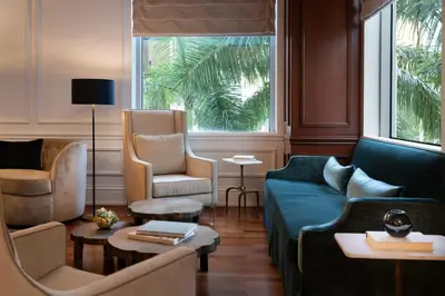 a living room with a couch and two chairs at JW Marriott Miami in Miami