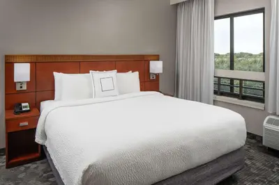 a bedroom with a large white bed and a window at Sonesta Select Miami Lakes in Miami Lakes