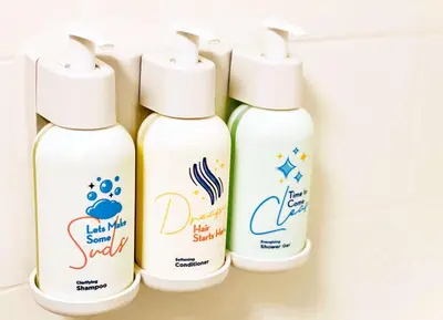 four bottles of cleaning products on a shelf at Sonesta Select Miami Lakes in Miami Lakes