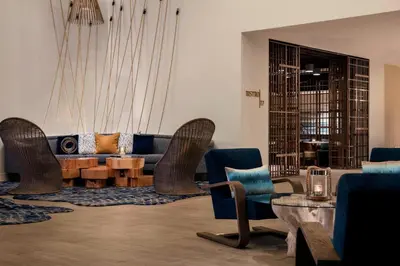 a living room with a couch and chairs and a table at Renaissance Fort Lauderdale Cruise Port Hotel in Fort Lauderdale