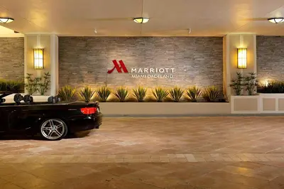 a black car parked in a lobby with a marriott sign at Miami Marriott Dadeland in Miami