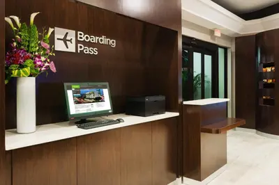 a computer sitting on a desk in a lobby at Courtyard Miami Downtown Brickell Area in Miami